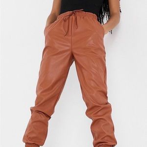Rust faux leather sweatpants